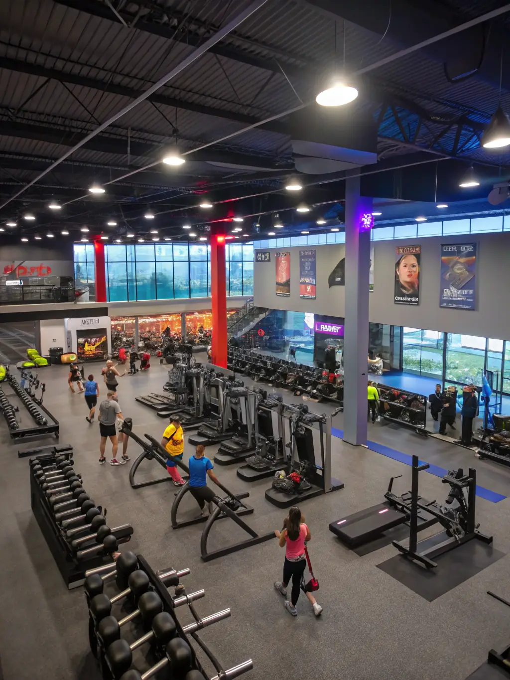 A modern and well-equipped gym at Be Fit, showcasing a variety of fitness equipment, including treadmills, weights, and machines, highlighting the comprehensive facilities available to members.
